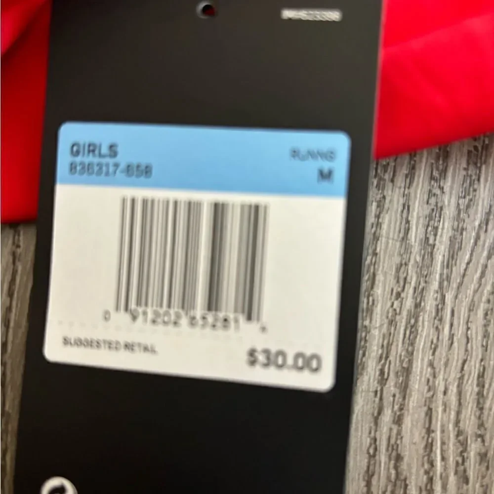 Nike gold running shorts with underwear lining